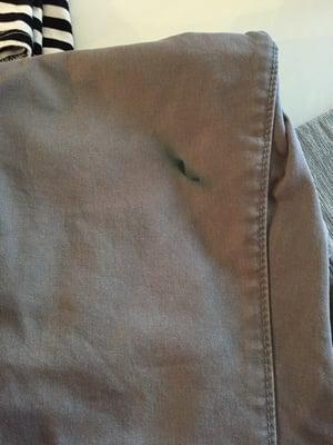 Not on my pants when I dropped them off.  Many other stains like this.   Never go here!