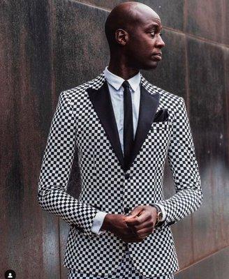 roducer, journalist and Tv host @charliisebunya with his check suit, custom printed by In Vogue Studios.