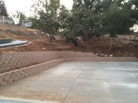 Stackable walls and large concrete pad.