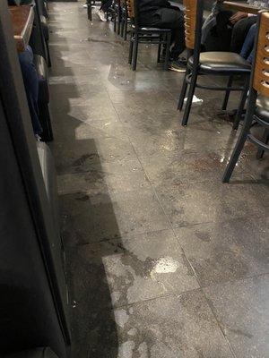 Dirty floor, multiple spills uncleaned.