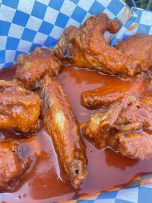 Hot wings... swimming in sauce