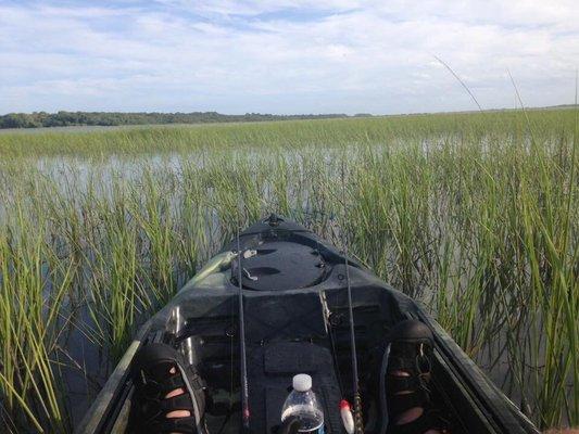 The Seaghost 130 made by Vibe Kayaks in action on a grass flat in northern FL.