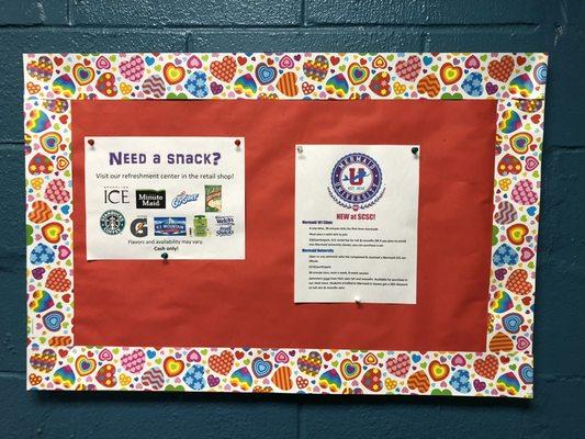 Bulletin board advertising the snacks and Mermaid University-- which sounds pretty rad.