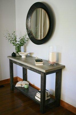 Concrete top console table with ebony base