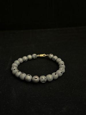 Iceman's Comedy & Tragedy bead bracelet
..... 28 beads finished with a black antique
finish & strung on spring wire. Available on website