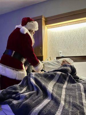 Santa visits with patients during the holiday season.