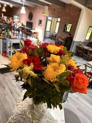 Fresh flowers with dining room in the background