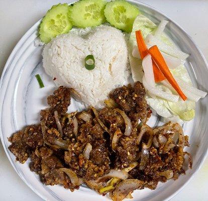 Lemongrass beef rice platter top with healthy vegetables and delicious homemade pickle (E 1 beef).