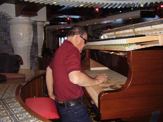 Repairing one of the piano's on one of the Cruise Ships I service each season.