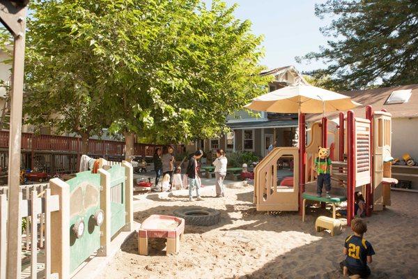 Wonderful outdoor space with lots of sand and a play structure