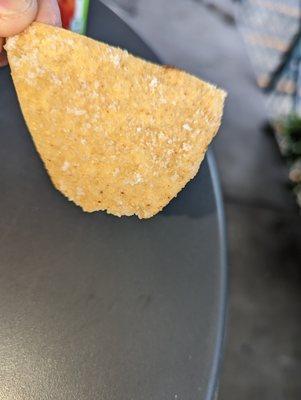 There is enough salt on this one chip for the whole meal!