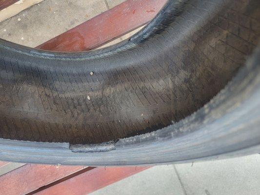 Here's the tire they sold us that was completely warped. You can see the bumps all around.