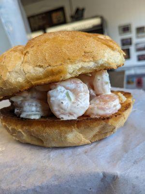 Shrimp salad sandwich on a buttered roll