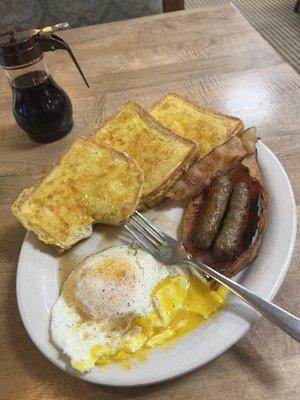 French toast, eggs, sausage links, ham, and bacon. Coffee was decent.