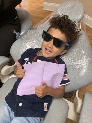 Two thumbs up after his first dental visit at our Fuquay office!