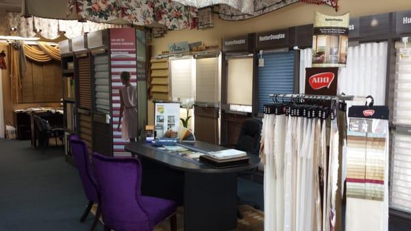 Wall to wall Hunter Douglas displays to give you any ideas for variety of window coverings options