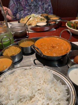 Shrimp masala curry thali and in the distance is the chicken biryanis thali