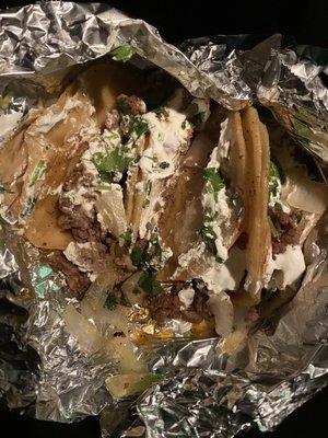 4 tacos wrapped together in foil