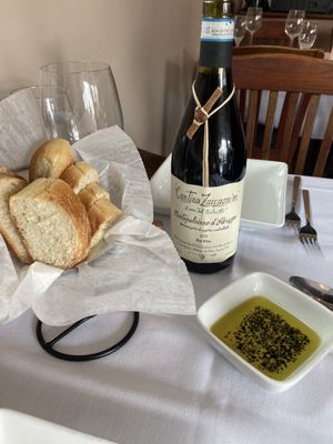 Warm Bread, Olive Oil w/Herbs & Bottle of Montepulciano D'Abruzzo Gifted by Friends! No Corkage Fee. Glasses & Opener Provided.