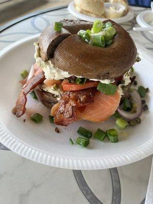 Nova sandwich on pumpernickel, toasted, add bacon with jalapeño cream cheese