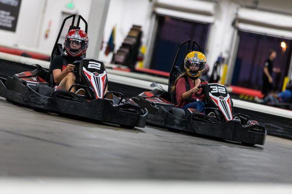 People racing go karts at K1 Speed