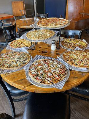 All of our specialty pizzas in one photo.