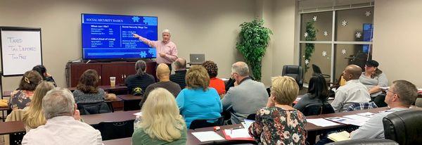 Bryan Gaiser giving a presentation during a seminar about retirement planning, estate planning, or Medicare supplements.