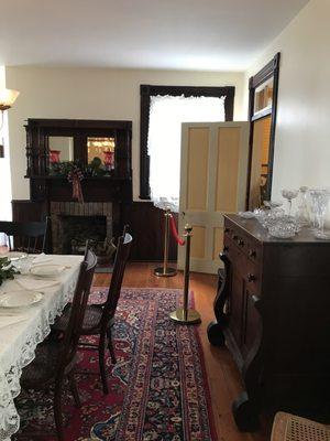 One of 5 fireplaces in the museum, this one is adorned with a Curly Pine mantle.