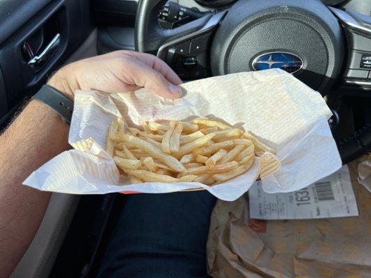 Half empty basket of fries.