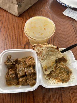 Goat curry, rice, and garlic naan bread. Absolutely delicious