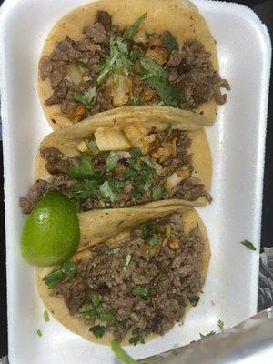 Carne Asada Tacos with onions and cilantro.