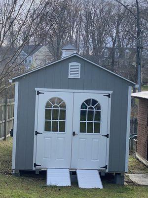 The outside of the shed with the ramps. The quality is very good.  Leveled perfectly in my yard.