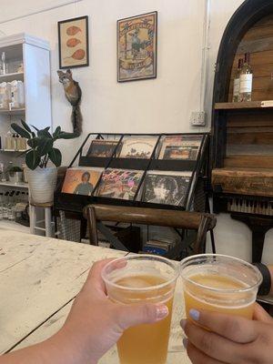 Lemon sour beer sitting in front of a selection of vintage vinyls!