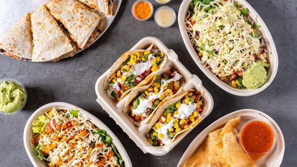 Taco dreams and quesadilla cravings come true! Fresh, vibrant Mexican flavors topped with creamy guac and spicy sides. Dig in!