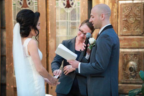 Handing me a tissue cause she's prepared for crying brides and grooms!