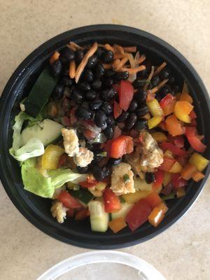 Fried chicken salad bowl with fresh beans, carrots, lettuce, tomatoes, cucumber.