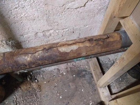 Broken 60-year-old cast iron pipe