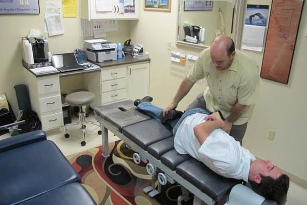 Dr Tropea performing an adjustment on a patient