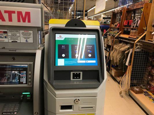 Bitcoin ATM and regular ATM at the store floor