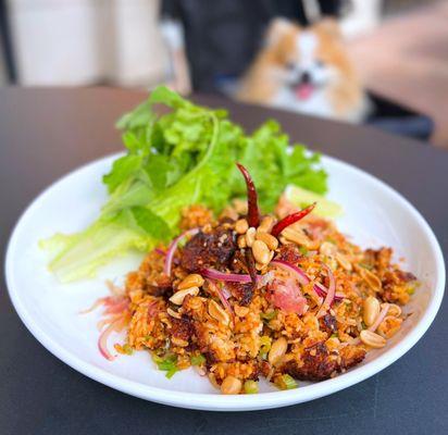 Nam Khao: Crispy rice, lime dressing, ginger, dried chili, red onion, peanut, mint, cilantro, ground pork, fermented sausage | $18.95