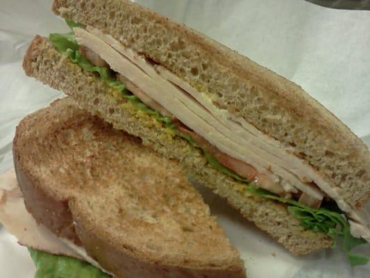 Turkey, lettuce, tomato, mustard & mayo between whole wheat toast.