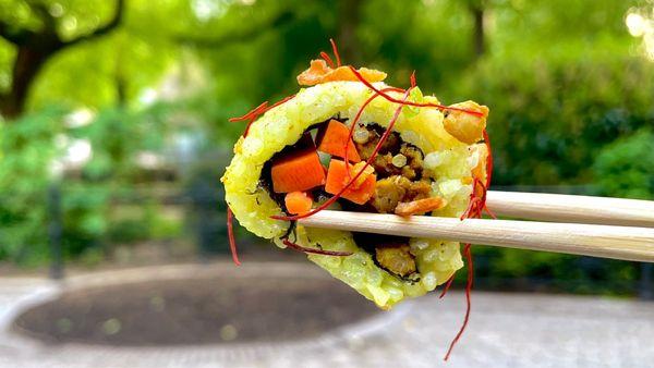 Enjoying Vegan Curry Sushi Rolls in Union Square Park