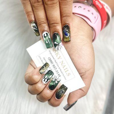 Cat-eye claws and Halloween hues at Sky Nails!  #HalloweenNails #CatEyeMani #SkyNailsMagic #SpookyNailArt #skynails209 #nailsdesign #nails