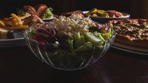 Our greek salad, pizza, ham club, Genoa salami grinder, and chicken française