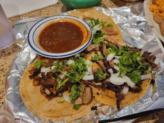 Street taco combo. Al pastor, carne asada, carnitas. Also comes with rice and beans