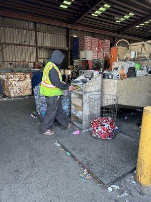 Weighing our cans and plastic