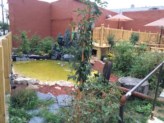 The pond in the outdoor eating area.