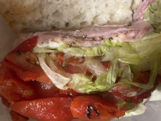 Special sandwich. Peppered ham, mozzarella, roasted red pepper, lettuce and tomato.