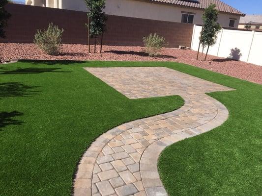 Synthetic lawn with paver patio