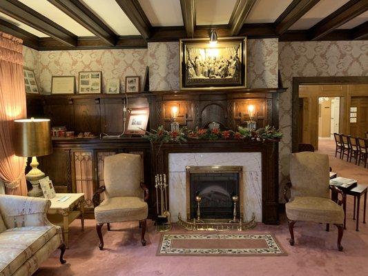 Our comfortable Lord's Supper Room. Comfortable seating and original hand carved oak, around fireplace and cabins are original from 1898